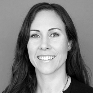 Krista Raines, Sustainable Design Consultant, in a professional black and white portrait